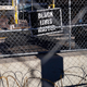A lone Black Lives Matter sign hangs on the fence surrounding the Hennepin County Government Center, where the trial for former Minneapolis police officer Derek Chauvin continues on Monday, March 29.